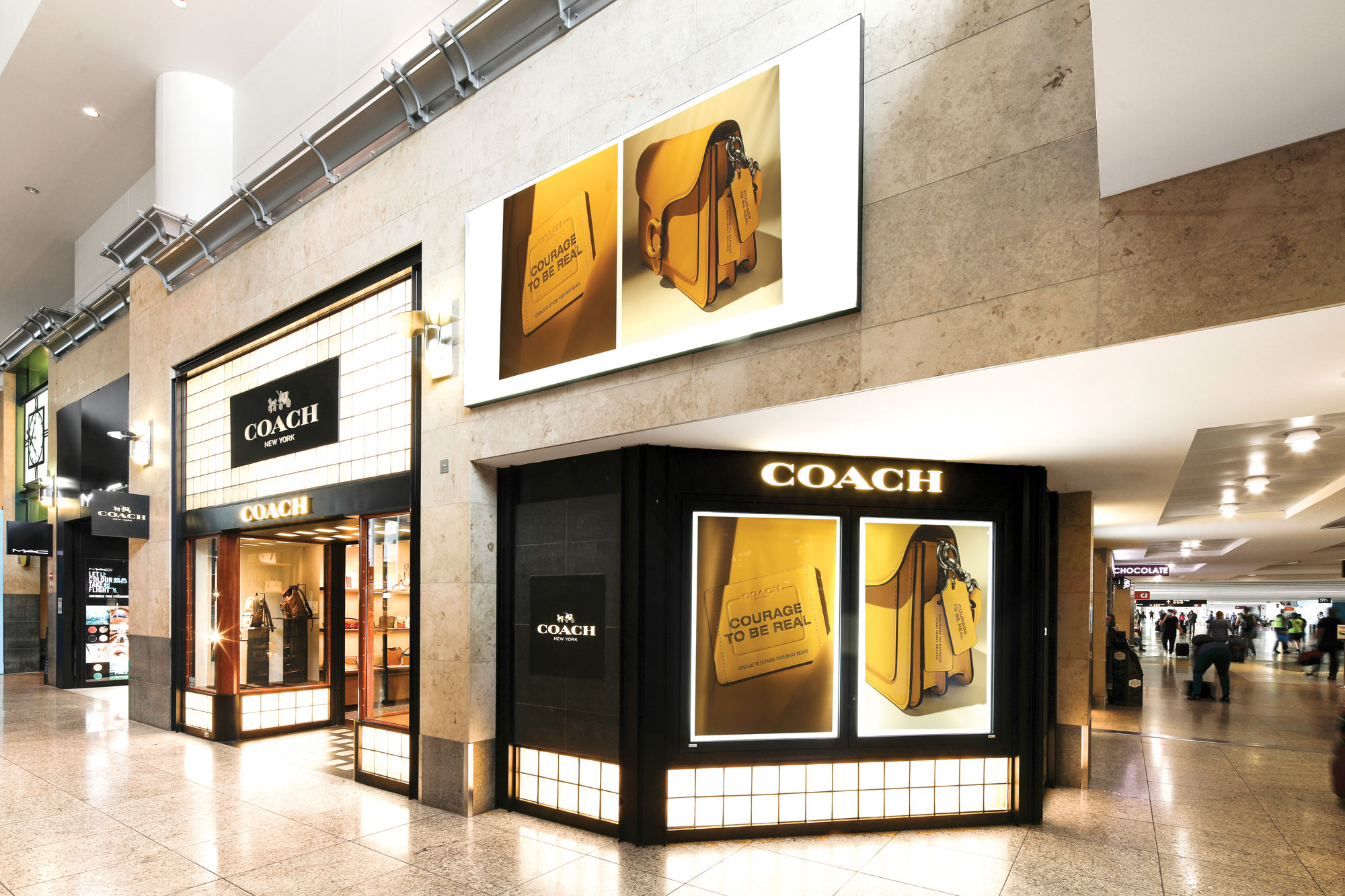 SEA Coach with MAC Cosmetics store in the background