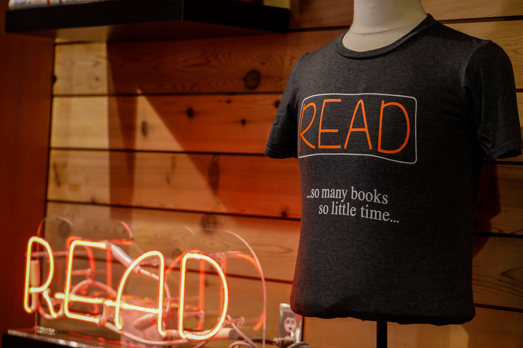 SEA Elliot Bay Book Company T-shirt and Neon Read Sign
