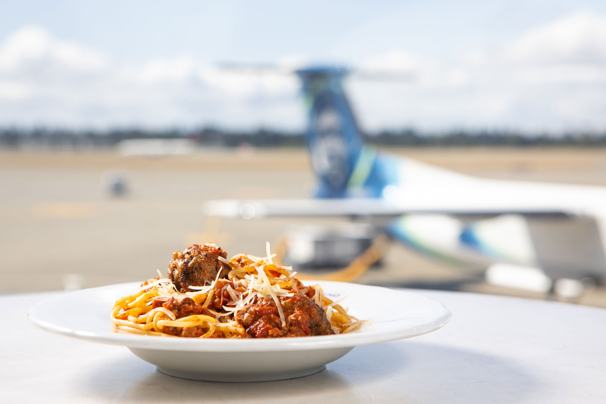 SEA Pallino Spaghetti and Meatballs with Plane in the Background