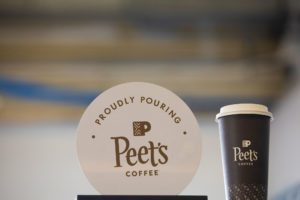 SEA Tap and Pour (S Gates) Proudly Pouring Peet's Coffee Sign and Cup