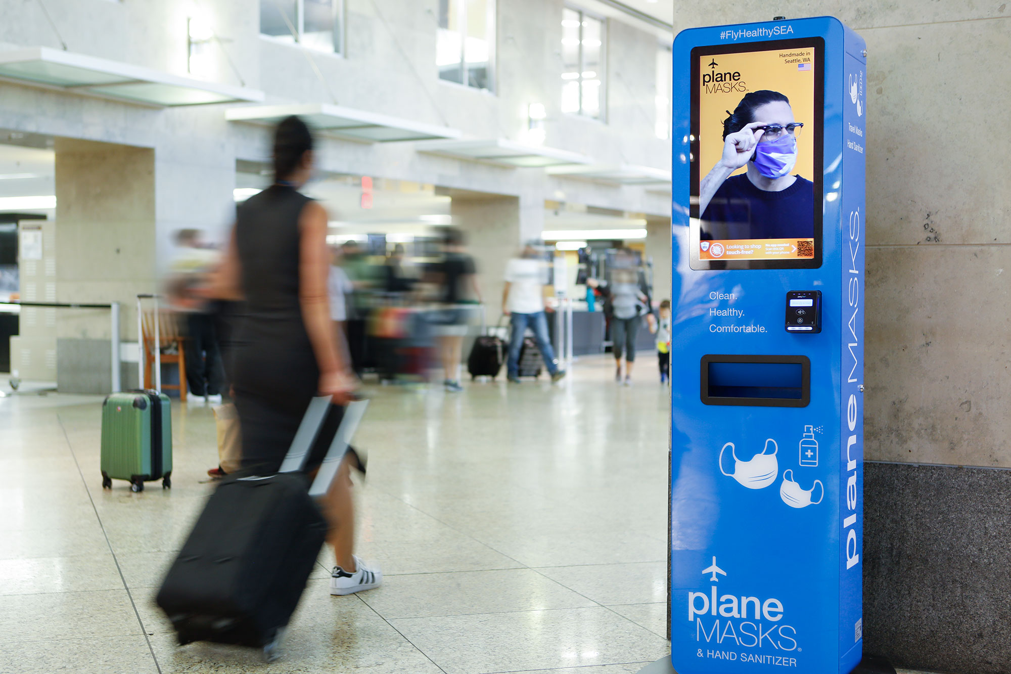 SEA Plane Masks Vending Machine with Traveler