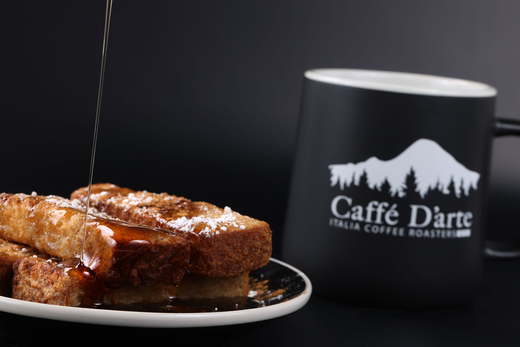 SEA Airport Caffe D'arte french toast with drizzling syrup and coffee mug