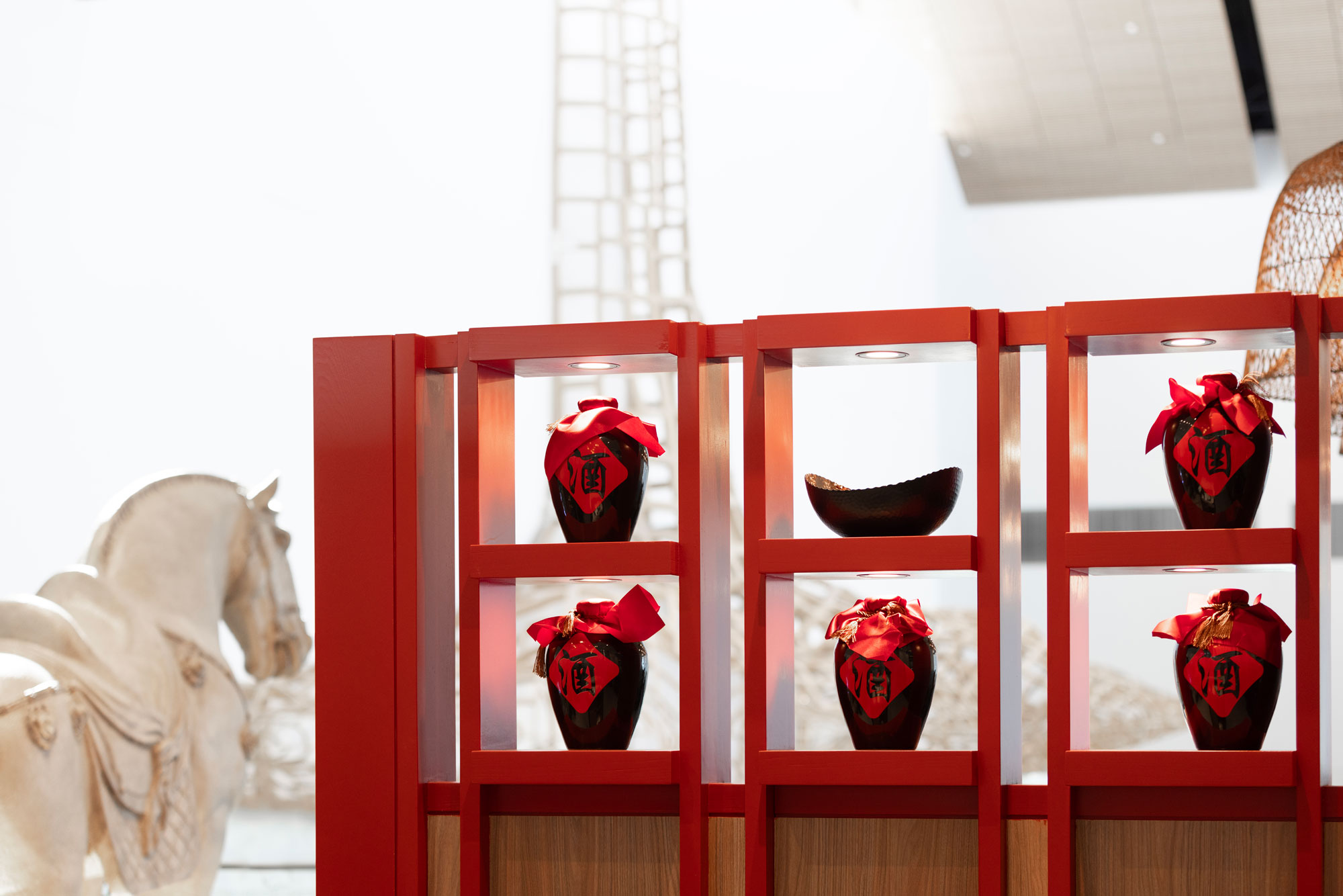 SEA Airport P.F. Chang's close-up details of red case with decorative vases and bowls