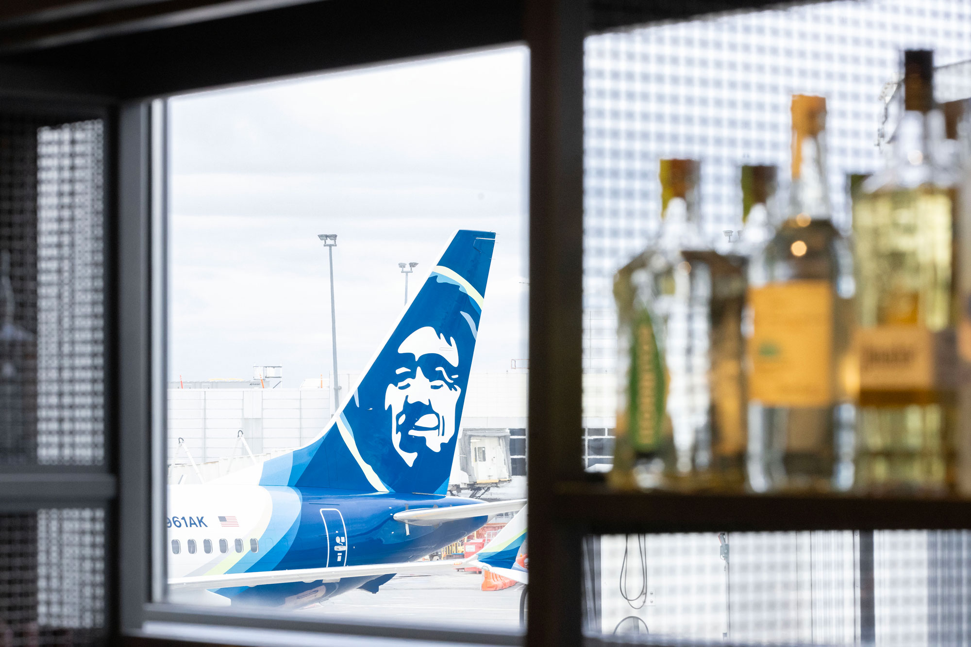 SEA Airport Seattle Dawg House window view looking at Alaska Airlines plane