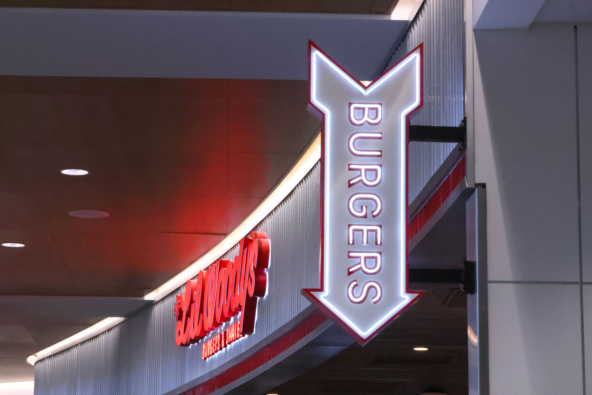 Lil Woody's Exterior facade and burgers blade sign