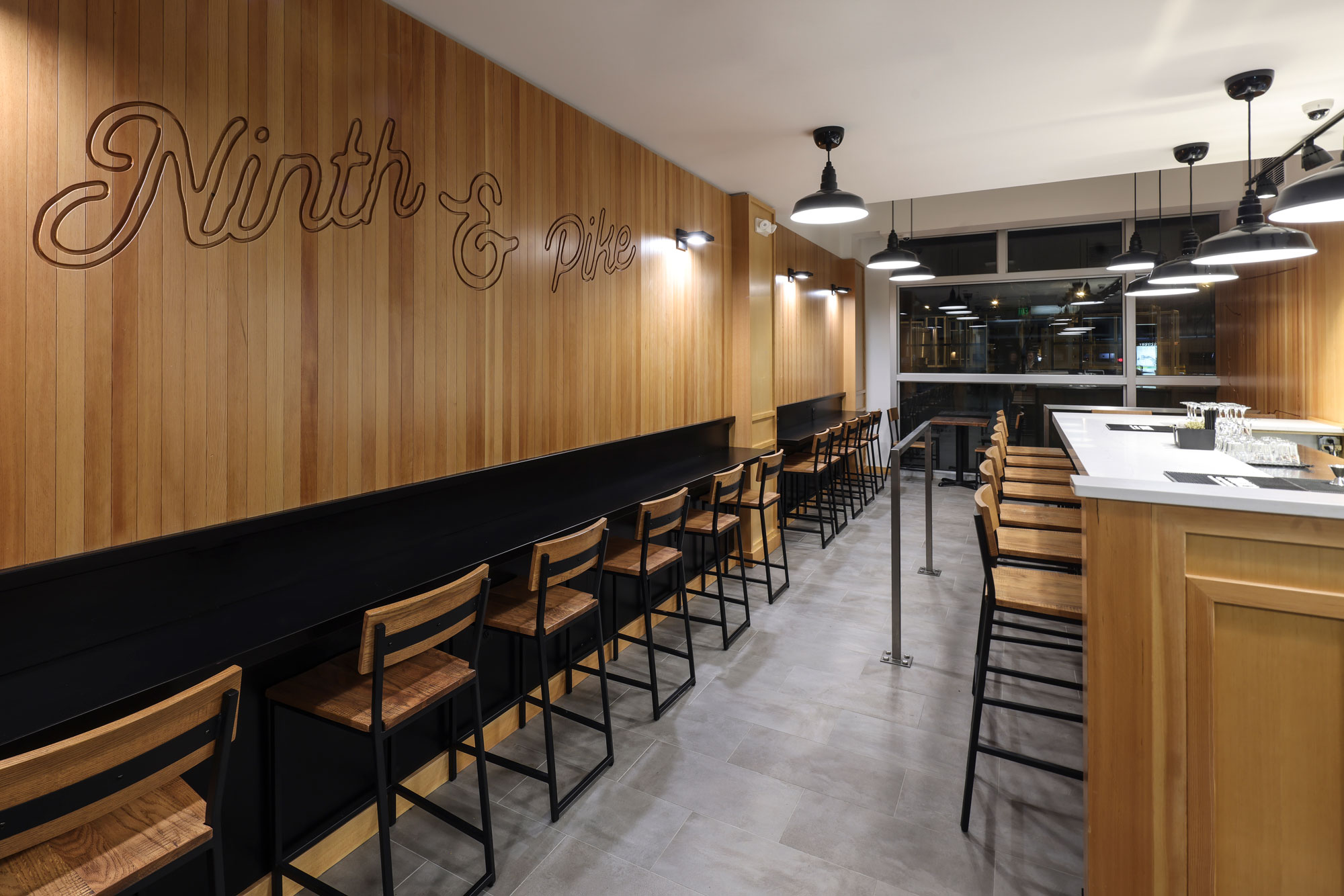 Ninth & Pike seating area with decorative wall