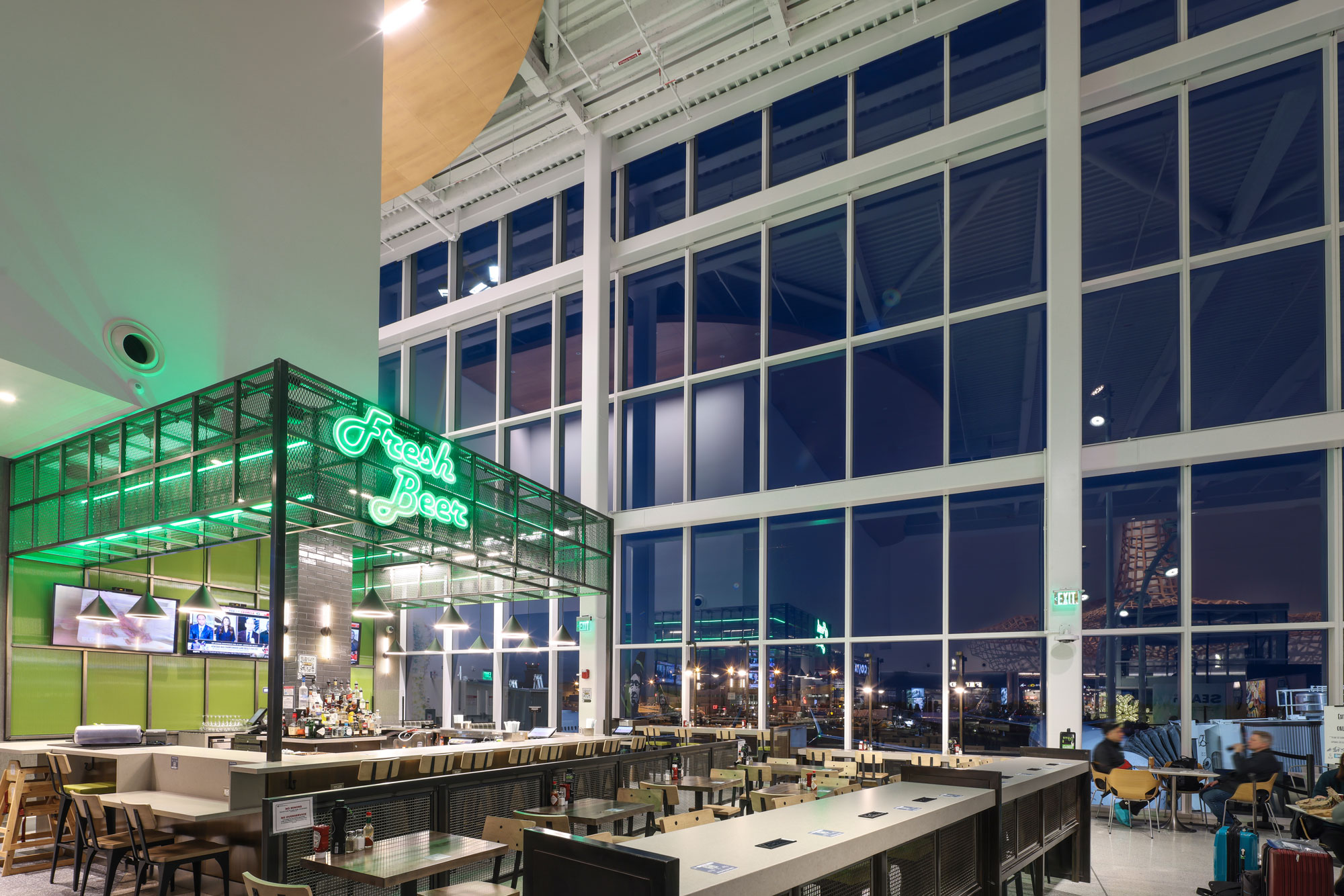 Open Space Tap Room bar and window seating at night