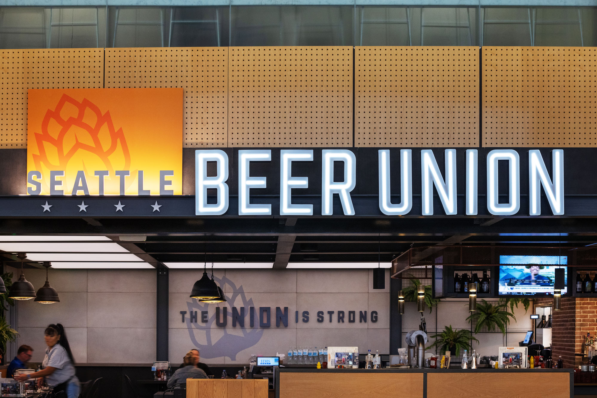 Seattle Beer Union Exterior reflecting "The Union is Strong" on wall