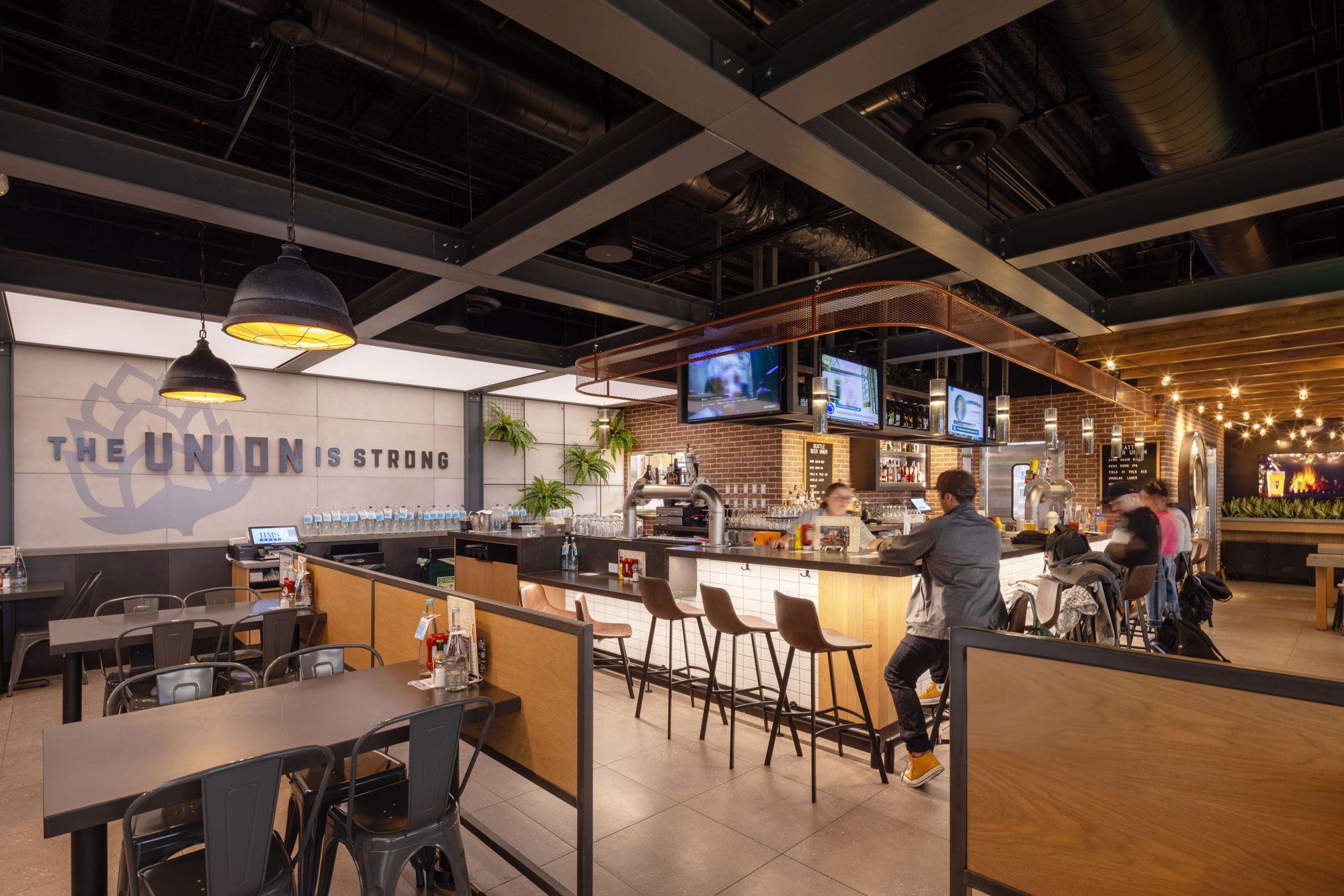 Seattle Beer Union with customers sitting at bar