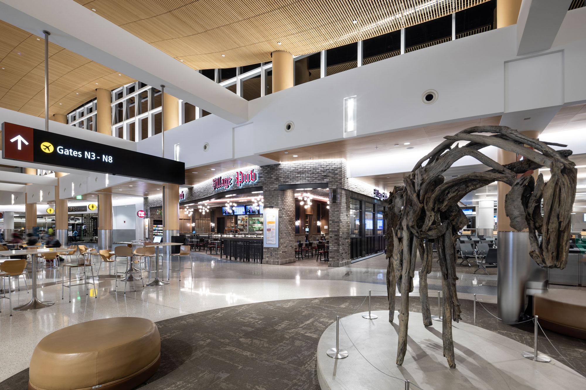 Village Pub exterior with Gates signage and terminal artwork