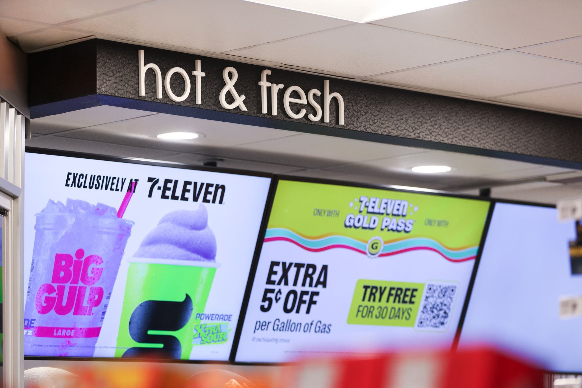 7-Eleven hot & fresh display with big gulp advertising