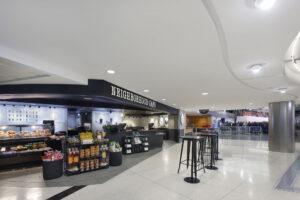 Neighborhood Cafe with merchandise display and seating in front
