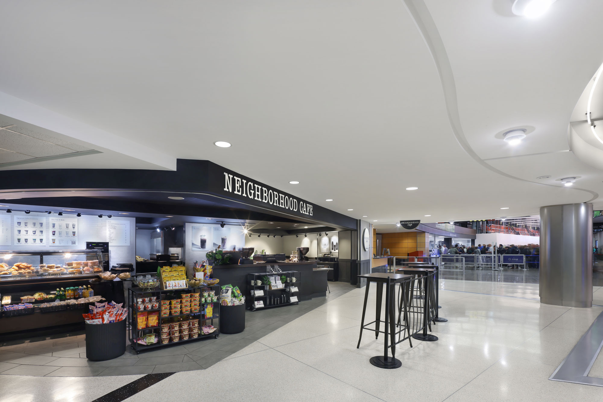 Neighborhood Cafe with merchandise display and seating in front