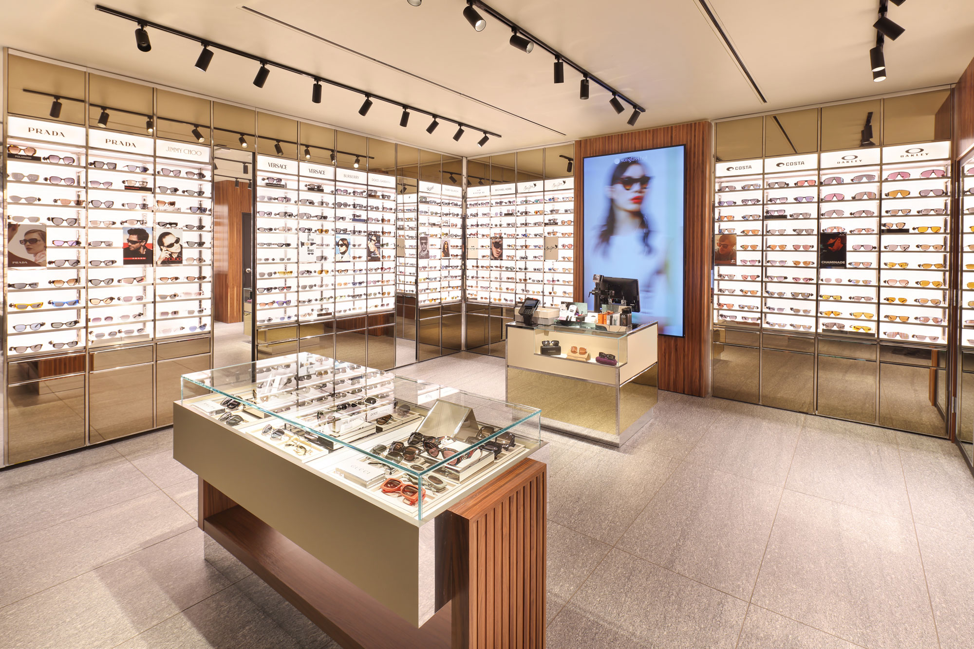Sunglass Hut interior view with glass cases
