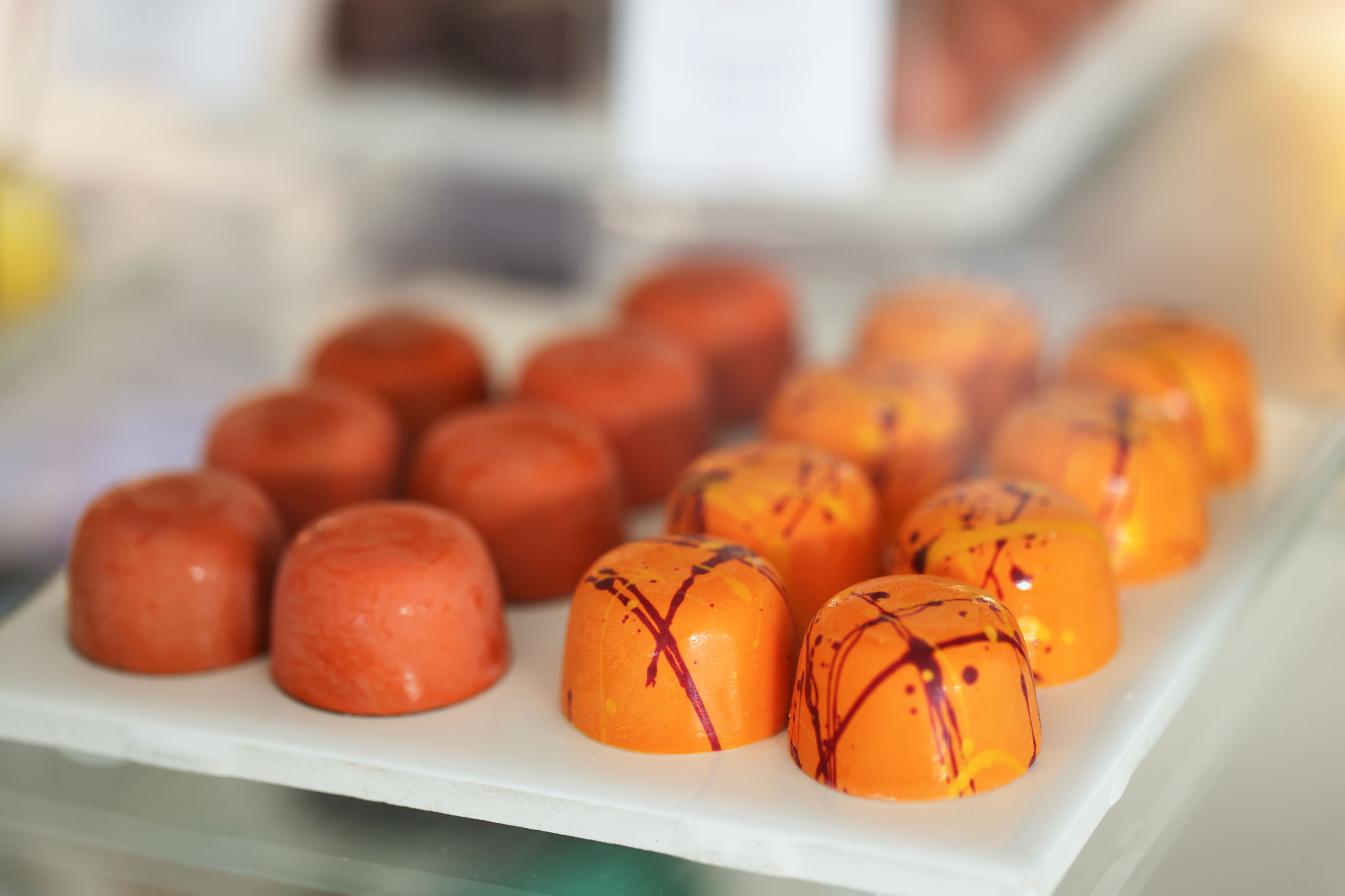 Theo Chocolate individual chocolate display with orange chocolates
