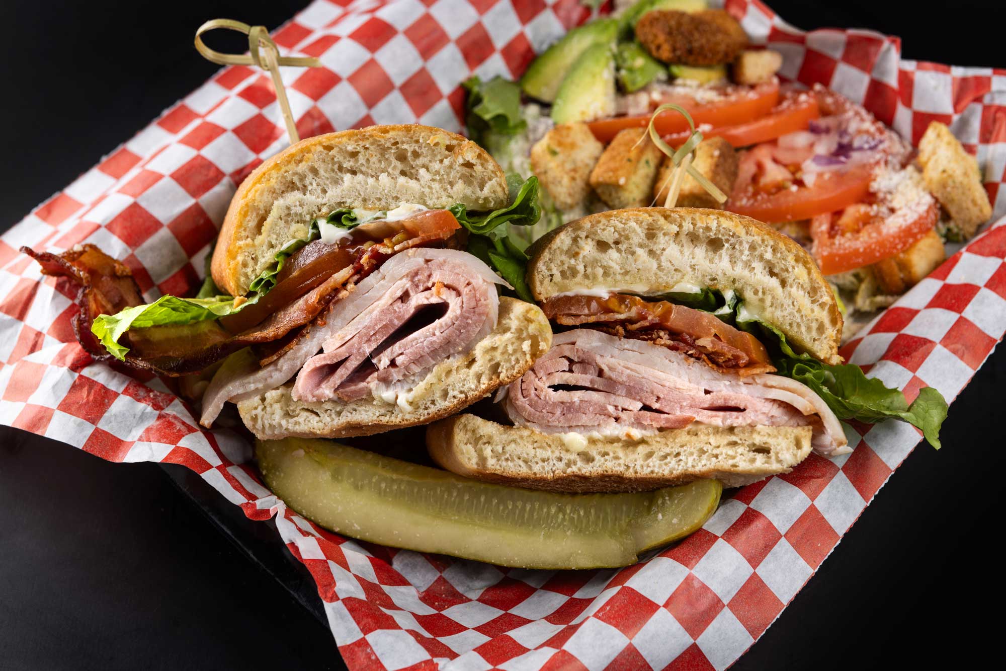 Village Pub sandwich, pickle, and salad