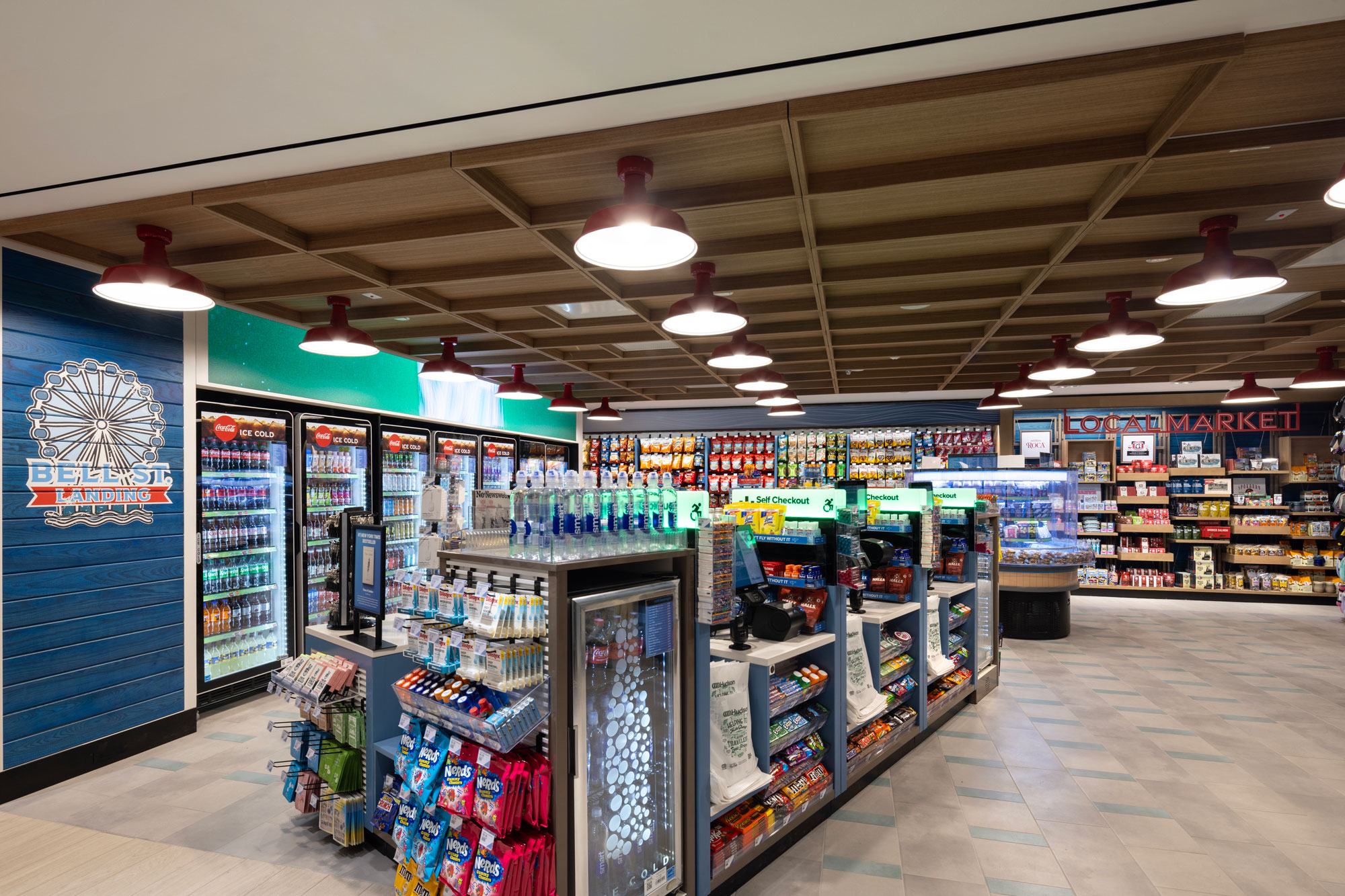 Bell St. Landing interior with self-service checkout displays