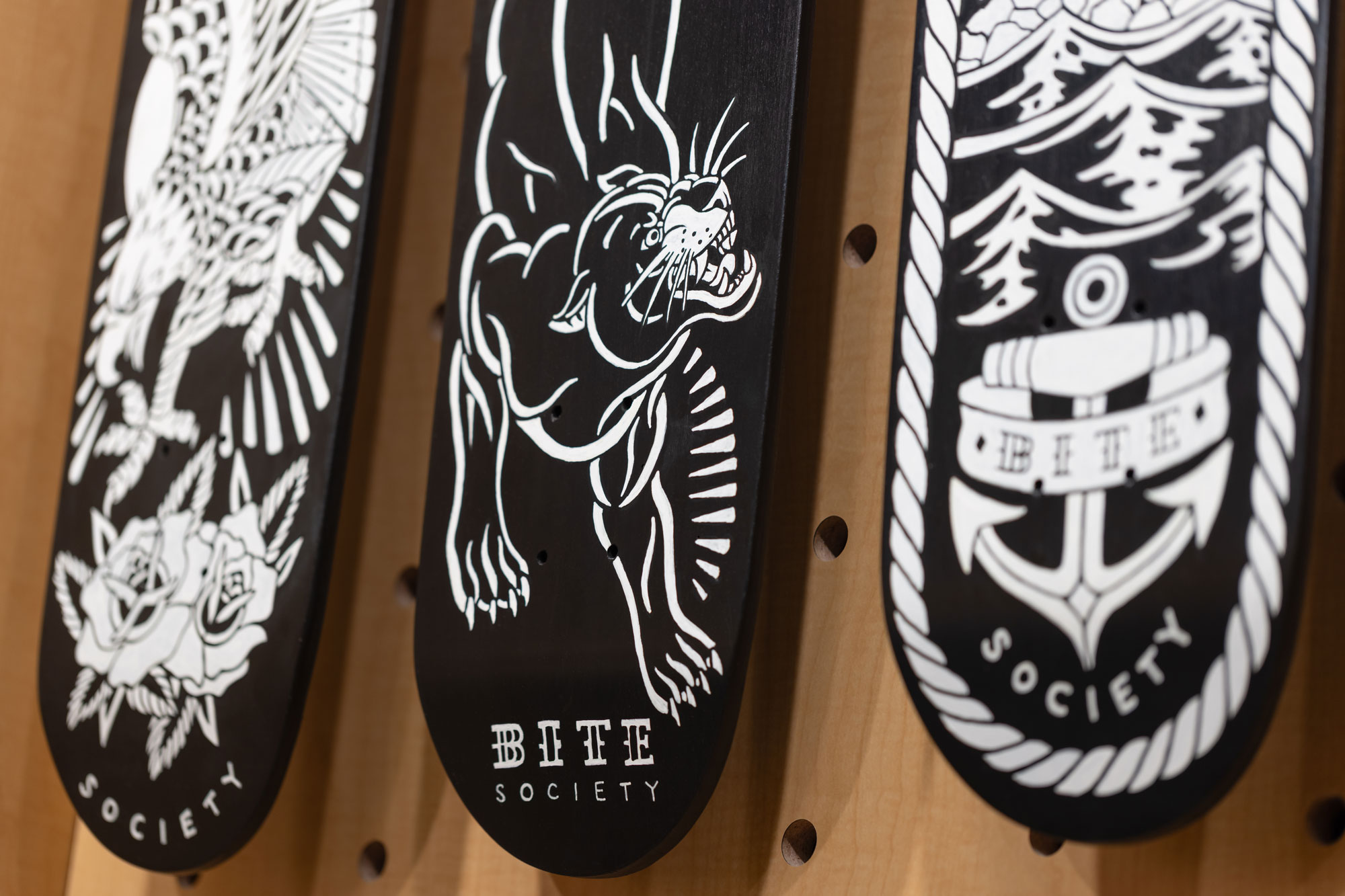 Bite Society branded skateboard decks
