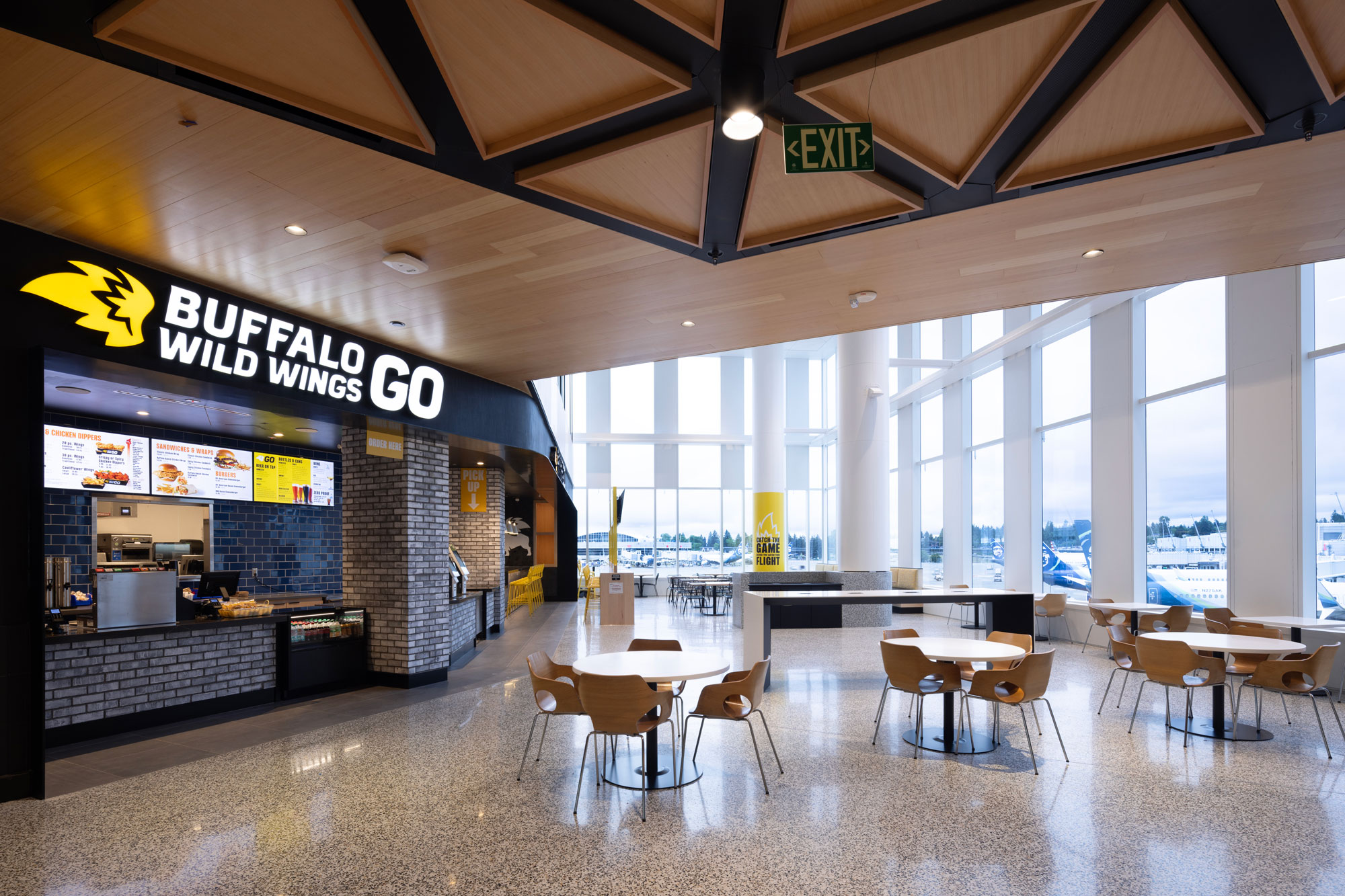 Buffalo Wild Wings dining and seating area with floor to ceiling windows
