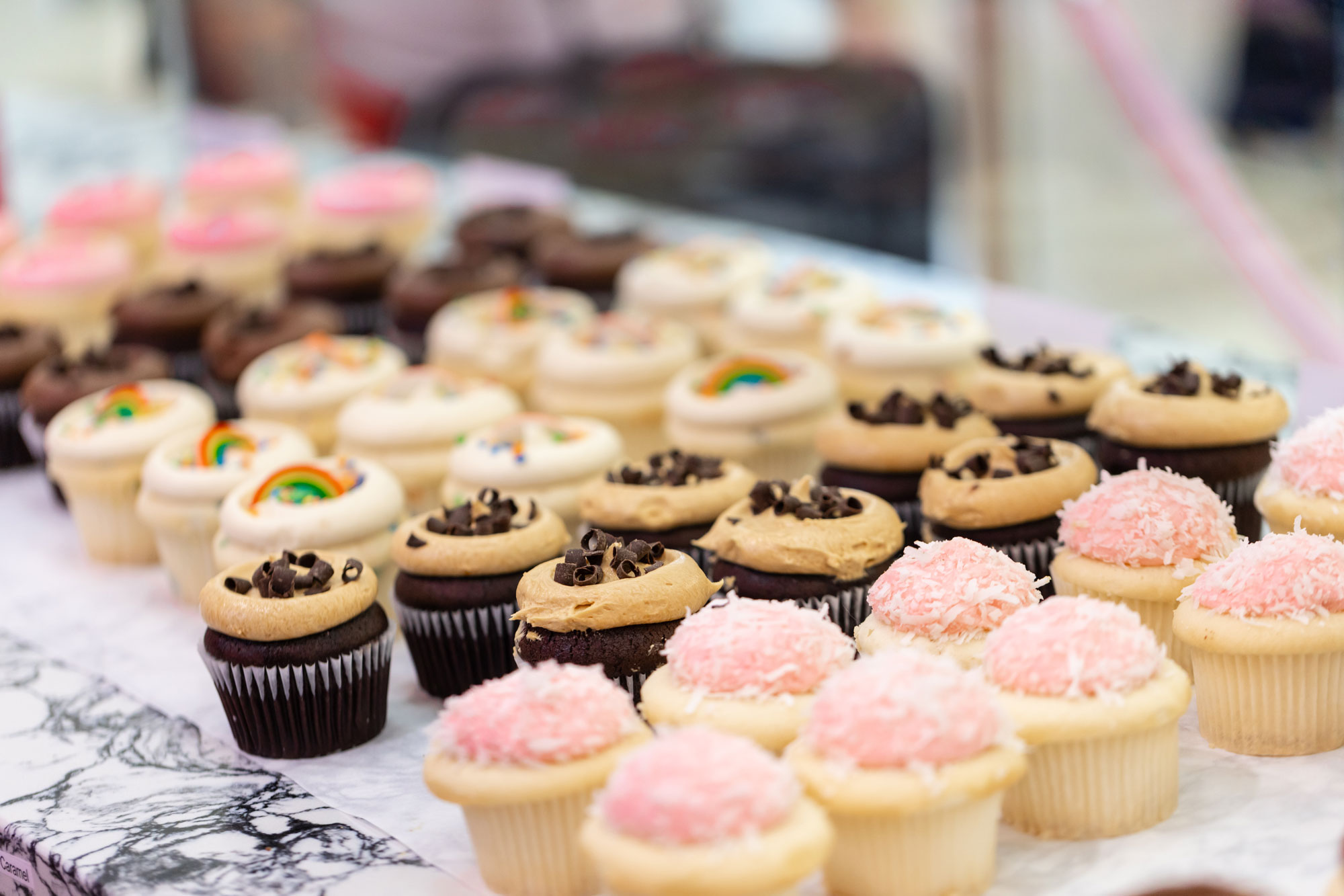 Cupcake Royale with strawberry coconut, vanilla rainbow, and chocolate cupcakes