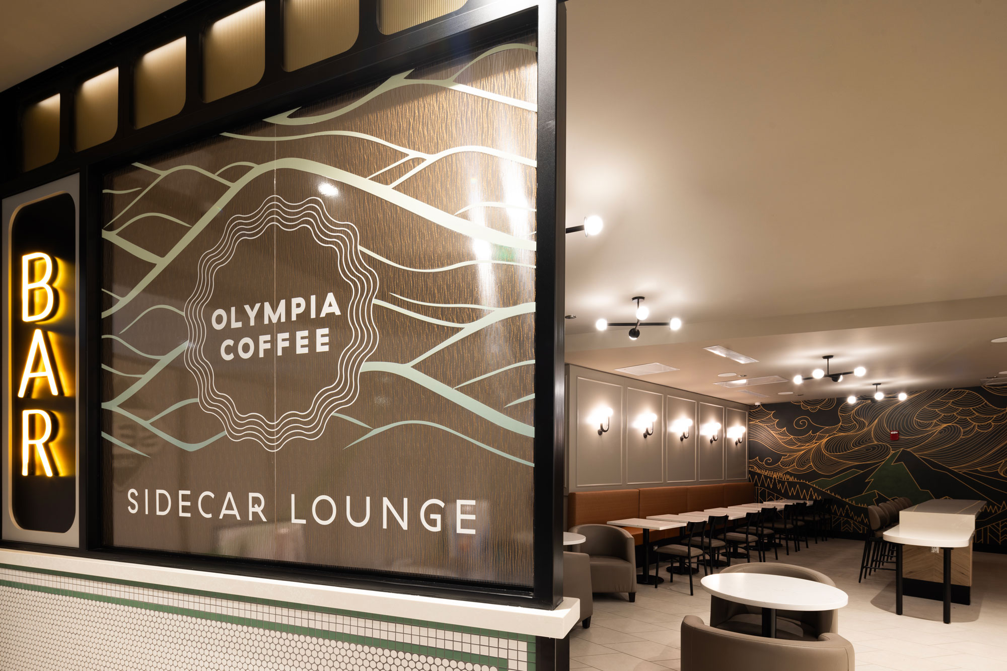 Olympia Coffee bar sign and seating